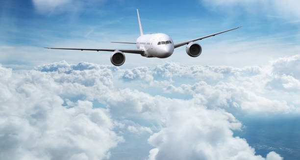 istock Commercial airplane flying above clouds. 1346345495