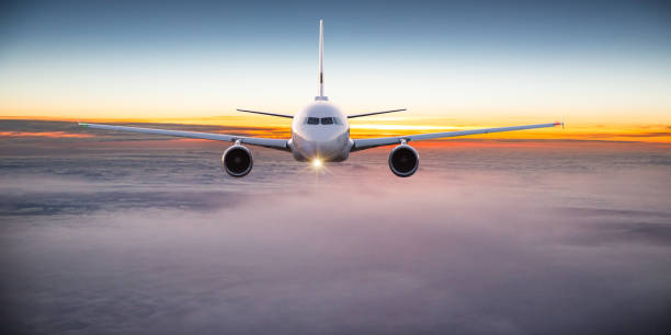 istock Commercial airplane flying above clouds. 1346345646