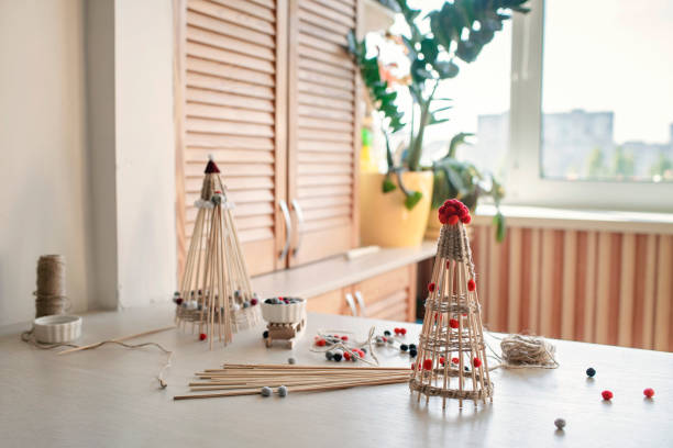 Wooden crafted Christmas tree from bamboo marshmallow roasting sticks, recyclable Christmas ornament, New Year DIY decoration, selective focus on craft