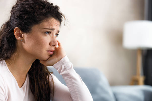 istock Depressed woman feeling lonely at home. 1346346937