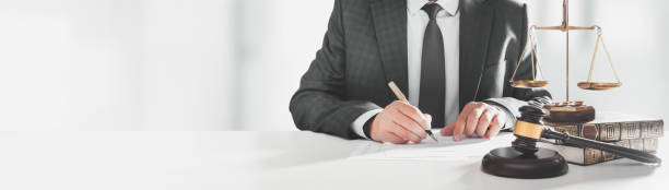 Lawyer signing agreement. Law and legal concept stock photo
