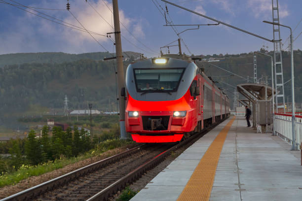 istock A red passenger train arrives at the railway station. Intercity communication. 1346351107