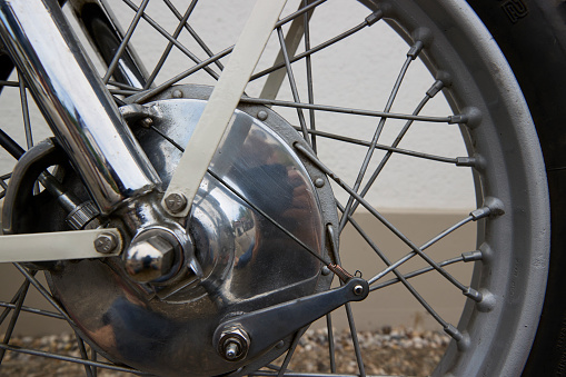 A photo of a dirty abandoned bike helmet in a street