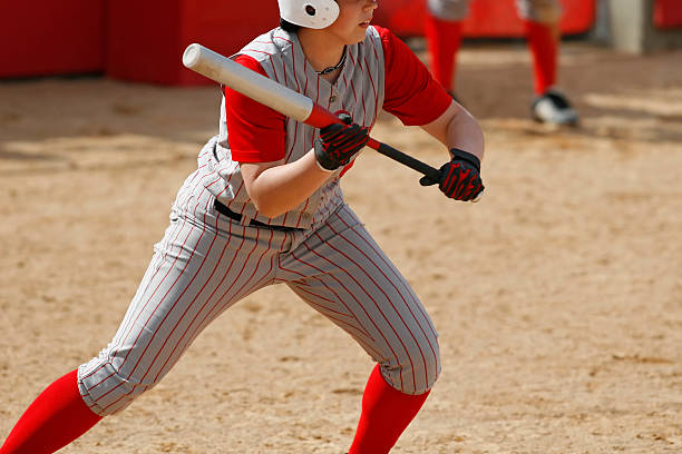 Ready to Bunt A softball player preparing to bunt. bunt stock pictures, royalty-free photos & images