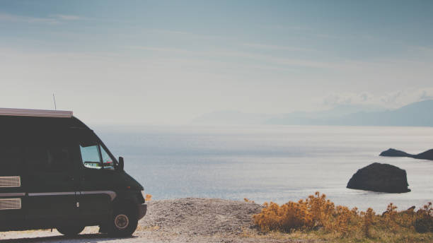 istock Camper car on beach sea shore. Travel 1346353966