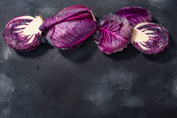 istock Red  cabbage, anthocyanin-rich atop dark background, top view, copy space 1346355766