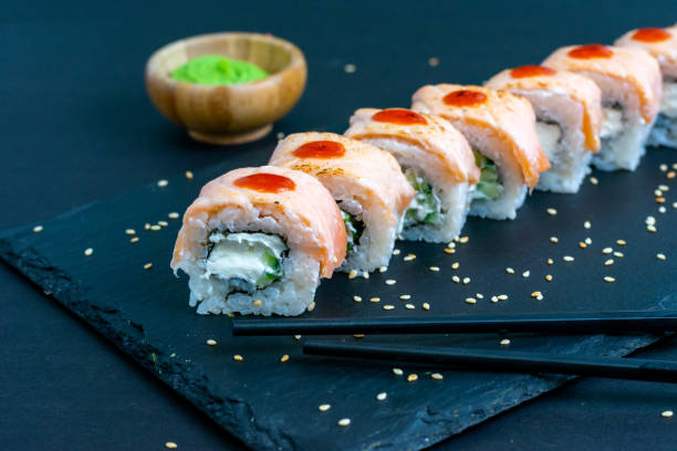 istock Grilled salmon sushi roll - japanese food 1346355803