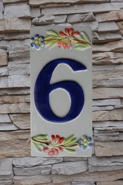 istock Street  Number 6  Ceramic plate placed on a house stone facade 1346359286
