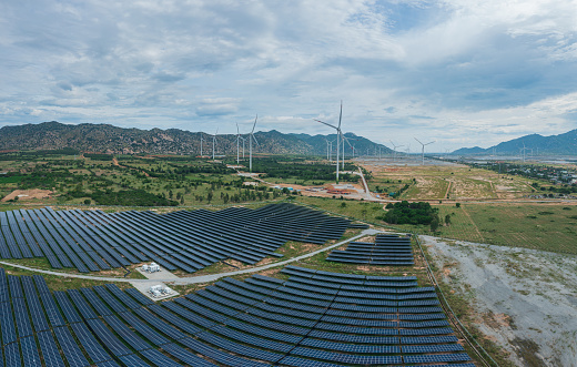 Drone view of the solar power farm combine with wind power turbine in Phan Rang, Ninh Thuan province, central Vietnam