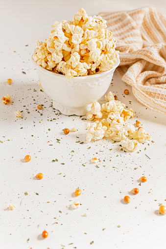 Cozy and aesthetic beige composition with popcorn. Autumn, winter food concept.