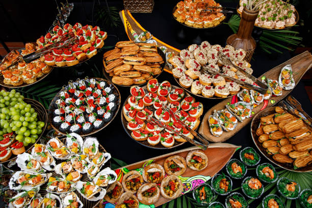 istock Buffet table of reception with cold snacks, meat, and salads. Top view. 1346363750