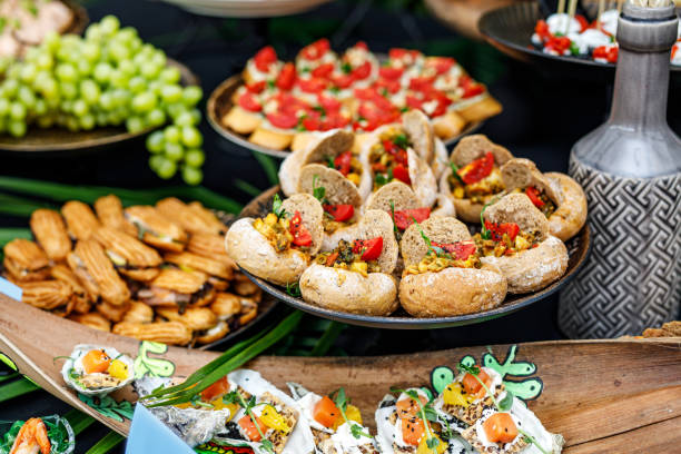 istock Buffet table of reception with cold snacks, meat, and salads 1346364100