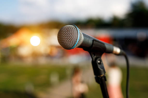istock Close Up Microphone on a outdoor stage. 1346364110