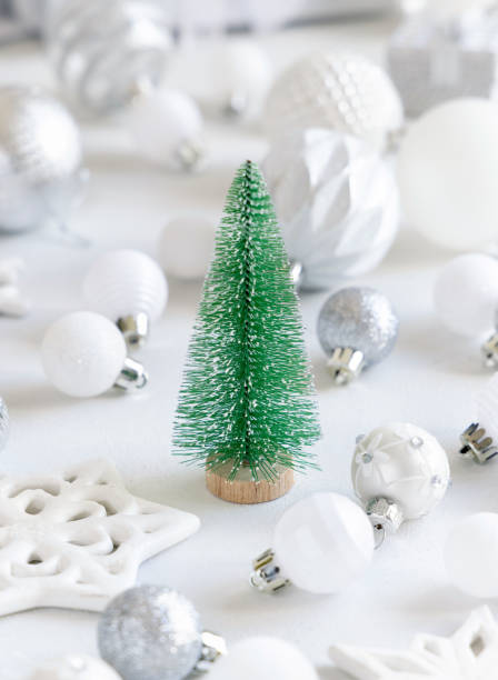 istock Green toy Christmas tree with white and silver Christmas decorations 1346365560