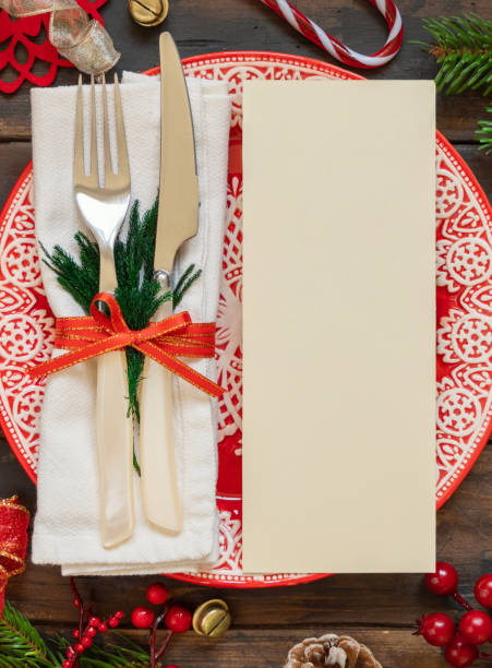 istock Menu card mockup. Festive table setting of with fir tree branches and Christmas decorations 1346365591