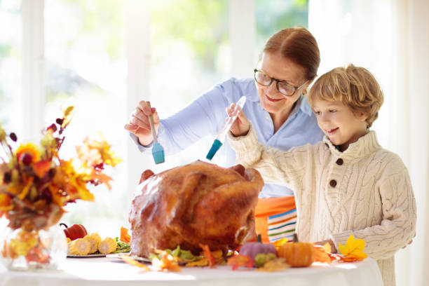 istock Family cooking Thanksgiving dinner 1346365907