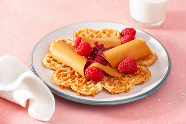istock waffles with Norwegian brunost traditional brown cheese and raspberry jam 1346368129