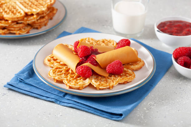 istock waffles with Norwegian brunost traditional brown cheese and raspberry jam 1346368728