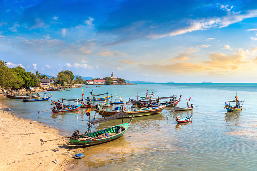 Thai fishing boats docked at Samui beach, Thailand in a summy day