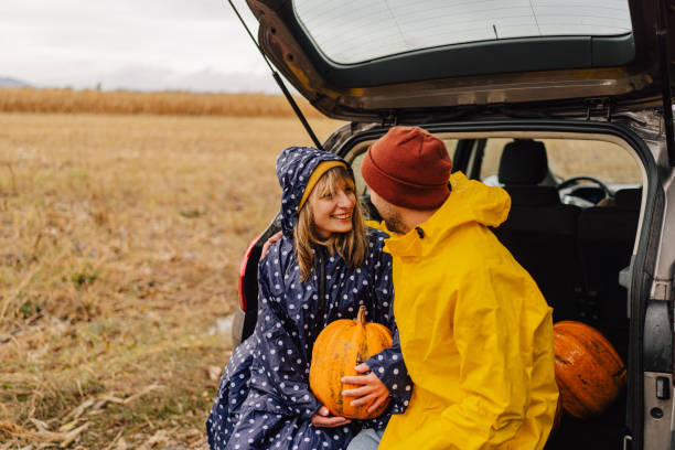 istock Smiling couple after pumpkins picking 1346369731
