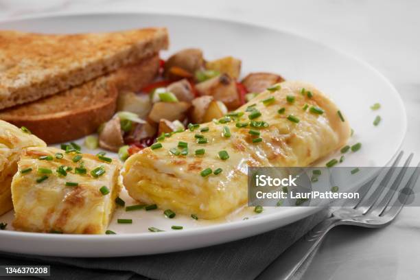 Cheesy Classic French Omelette Stock Photo - Download Image Now - Omelet, Breakfast, Egg - Food