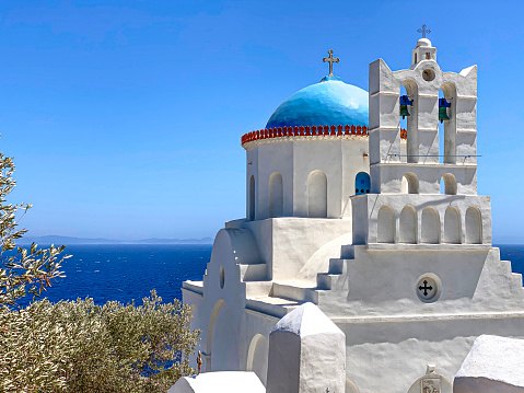 Traditional bells tower and blue dome  of the orthodox white churches, Sifnos island, Greece