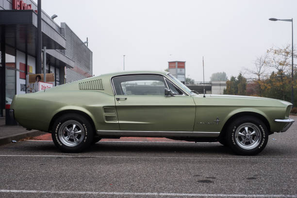 Profile view of Ford mustang 1967 fastback parked in the street stock photo
