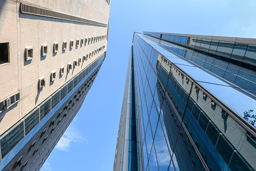 High rise building with reflective glass in the blue sky