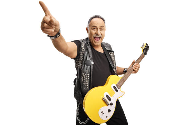 istock Rock guitarist with an electric guitar pointing with finger 1346374538