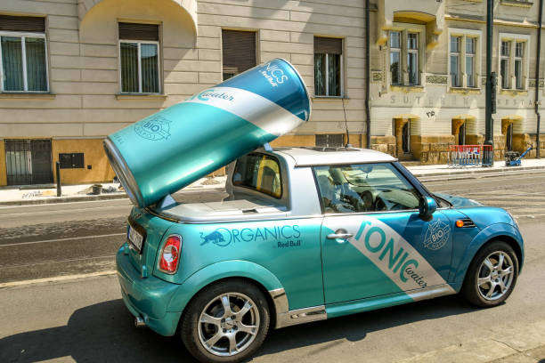 Unusual vehicle used to promote a drinks business Prague, Czech Republic - July 2018: Custom design car to promote Red Bull tonic waters on a street in Prague. red bull mini stock pictures, royalty-free photos & images