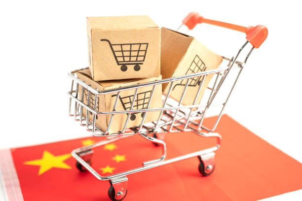 Box with shopping cart logo and China flag, Import Export Shopping online or eCommerce finance delivery service store product shipping, trade, supplier concept. stock photo