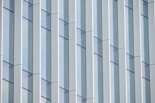 istock High rise building with reflective glass in the blue sky 1346376674