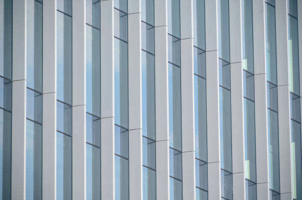 istock High rise building with reflective glass in the blue sky 1346376686