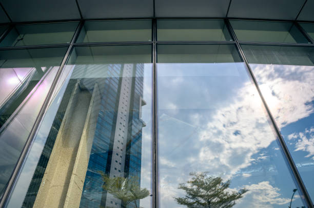 istock High rise building with reflective glass in the blue sky 1346376718