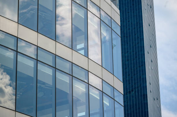 istock High rise building with reflective glass in the blue sky 1346376899