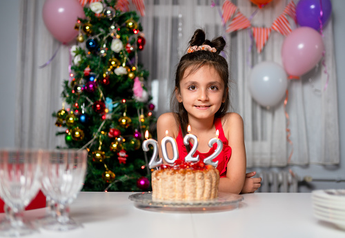 little girl Celebrating Christmas At Home 2022