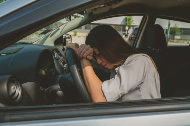 istock Stressed woman driver sitting inside her car 1346377669
