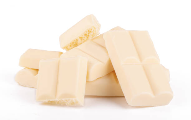 istock Lots slices of white chocolate isolated on white background close up 1346380621