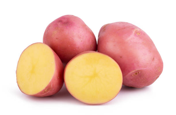 whole and sliced potato, isolated on white background close up - raw potato human skin red pink imagens e fotografias de stock