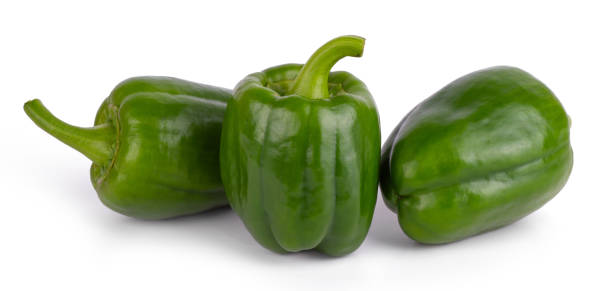 istock Group of fresh green bell peppers isolated on a white background 1346380741
