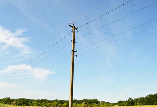 Power electric pole with line wire on colored background close up