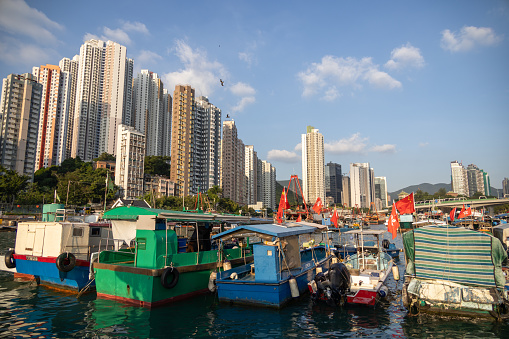 Hong Kong - October 11, 2021 : Fishing boats, junks and other vessels are moored in Aberdeen Harbour, Hong Kong. Aberdeen Harbour is the harbour between Aberdeen and Ap Lei Chau.