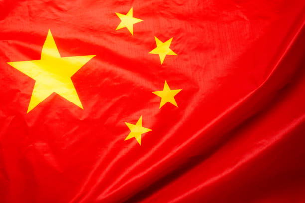istock China flag waving as a background. 1346384557
