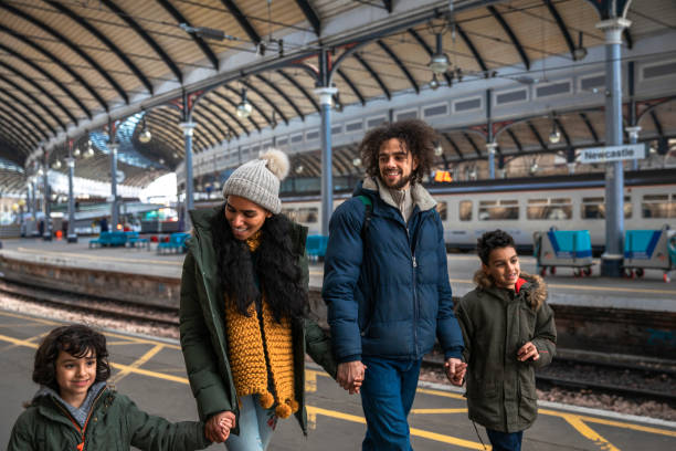 istock Walking Through the Railway Station Together 1346385880