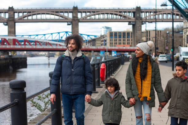 istock Family Holding Hands by the River 1346386616