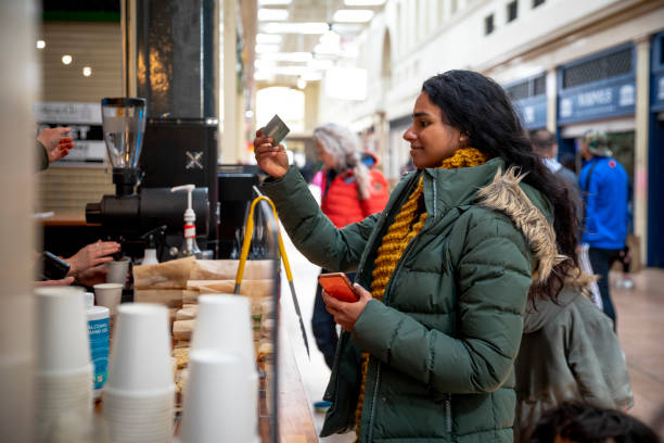 paying for a coffee - telephone indoors retail shopping mall imagens e fotografias de stock