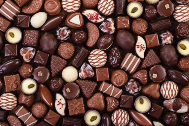 istock assorted sweet food, chocolate truffle and candy background 1346387896