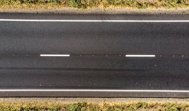istock Aerial. Empty countryside highway asphalt road. Top view. 1346390232