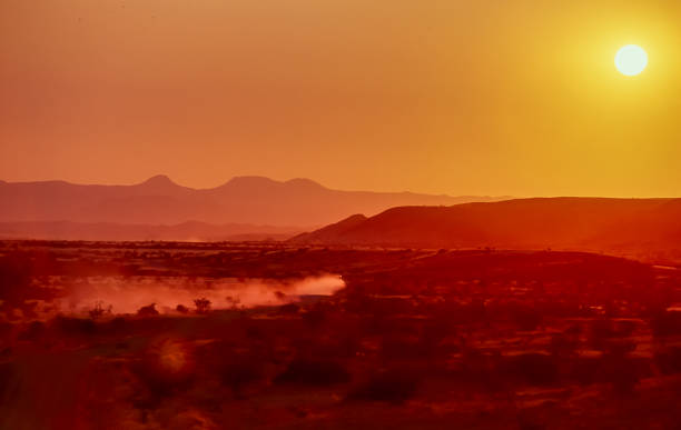 istock Red sunset on a sandy track in Namibia. 1346393347