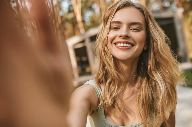 istock Happy young woman looking at camera 1346393826